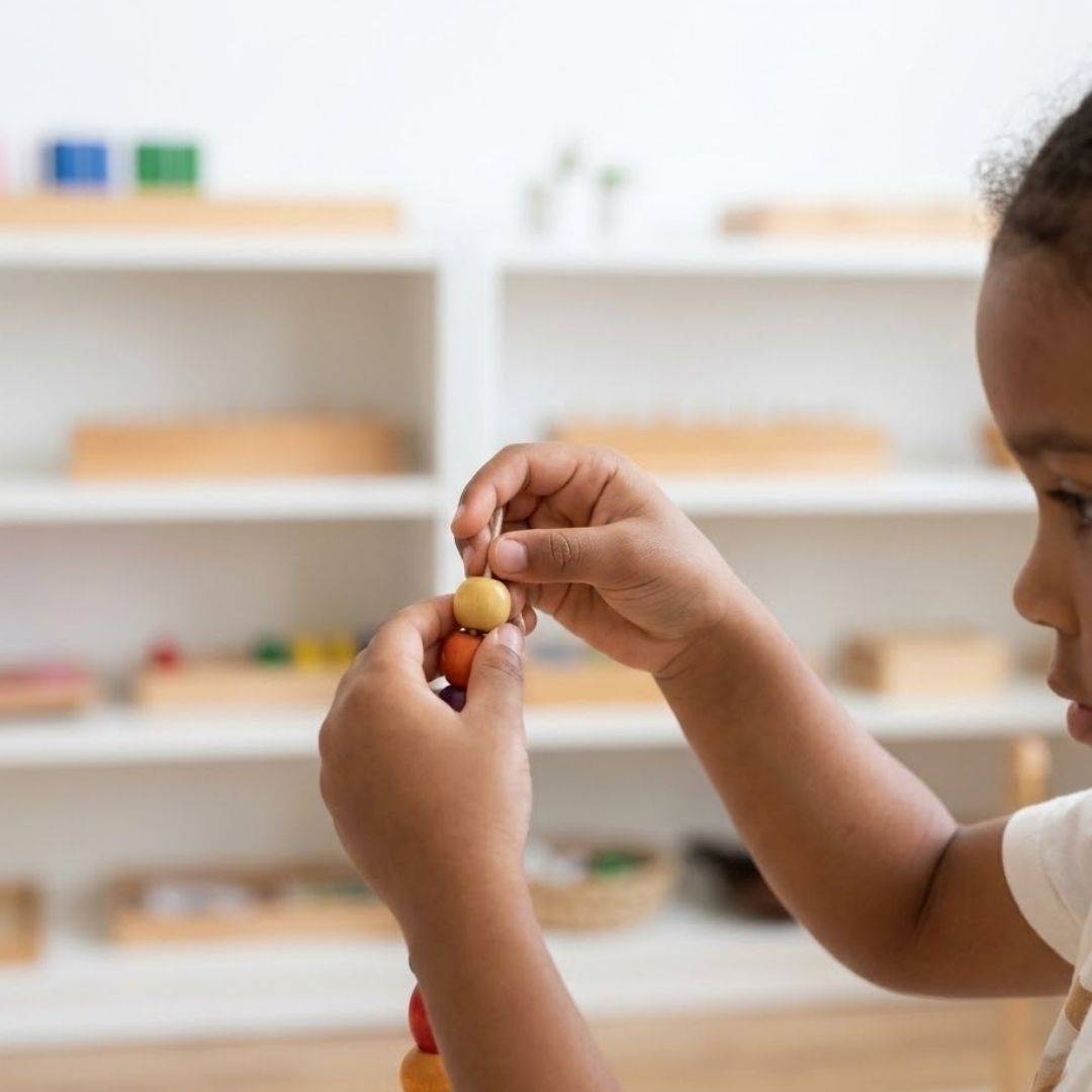A diverse student works with bead materials